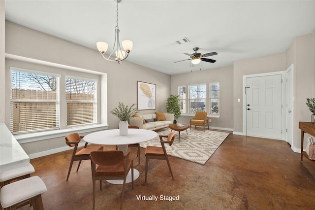 dining room with ceiling fan with notable chandelier