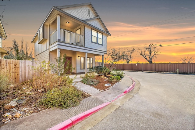 view of front of home with a balcony