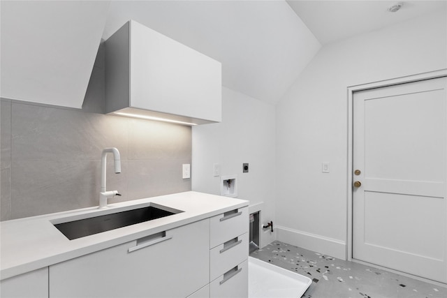 laundry area with electric dryer hookup, cabinets, washer hookup, and sink