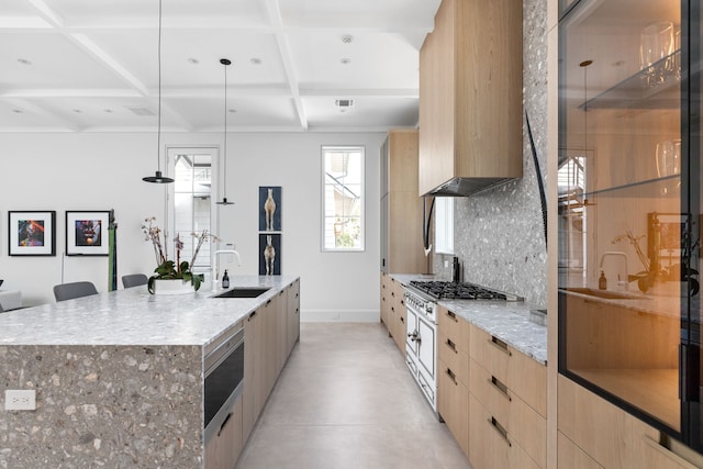 kitchen with a large island with sink, a breakfast bar area, decorative backsplash, coffered ceiling, and pendant lighting