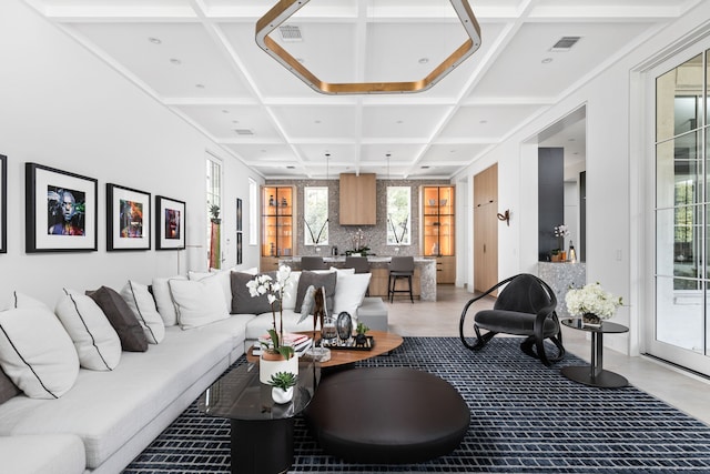 living room featuring coffered ceiling