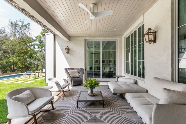 view of patio / terrace with ceiling fan, a swimming pool, and outdoor lounge area