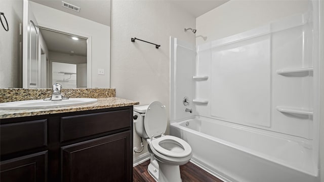 full bathroom featuring vanity, shower / washtub combination, toilet, and hardwood / wood-style floors