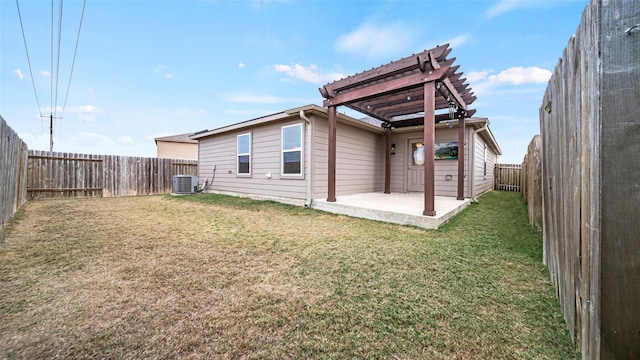 back of house with a lawn, central AC, a pergola, and a patio