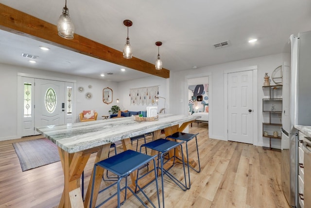 407 S Pine St, Georgetown, TX 78626 - kitchen featuring light wood-style floors, beam ceiling, freestanding refrigerator, recessed lighting, and pendant lighting