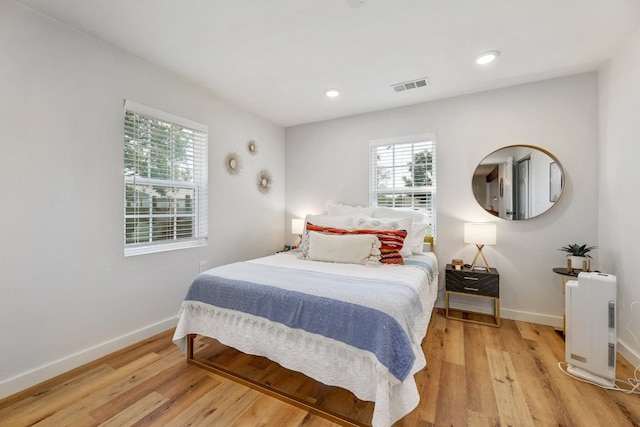407 S Pine St, Georgetown, TX 78626 - bedroom with baseboards, light wood-type flooring, and recessed lighting