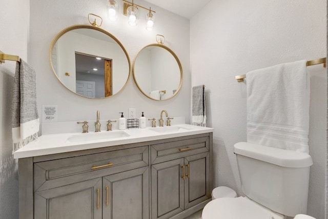407 S Pine St, Georgetown, TX 78626 - bathroom featuring double vanity and toilet