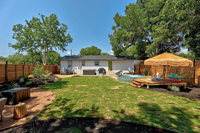 407 S Pine St, Georgetown, TX 78626 - back of property featuring a jacuzzi and a wooden deck