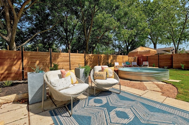407 S Pine St, Georgetown, TX 78626 - fenced backyard with a jacuzzi and a patio area