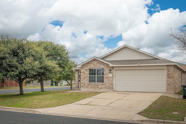 view of front of house featuring a front yard and a garage