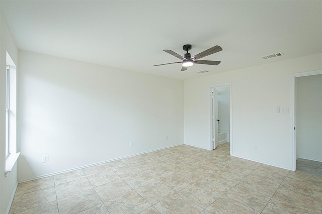 spare room with ceiling fan