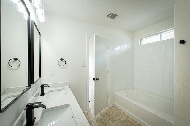 bathroom with shower / bathing tub combination, vanity, and tile patterned floors