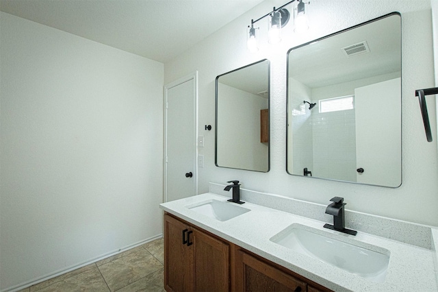 bathroom with a shower and vanity