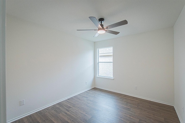 unfurnished room with ceiling fan and dark hardwood / wood-style flooring