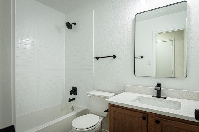 full bathroom featuring toilet, bathing tub / shower combination, and vanity