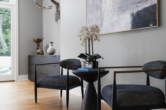 living area with hardwood / wood-style flooring