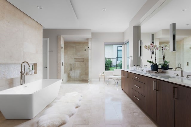 bathroom featuring separate shower and tub and vanity