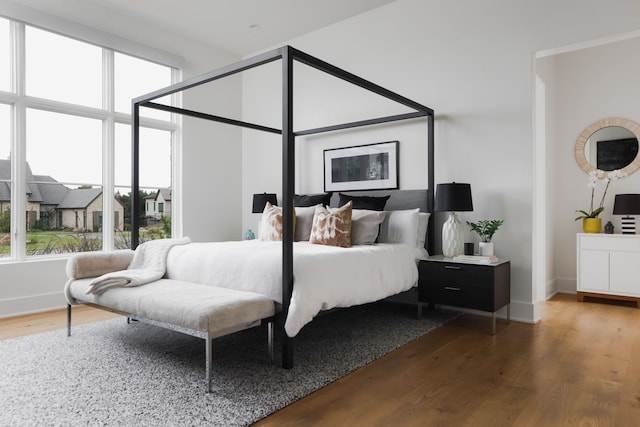 bedroom with hardwood / wood-style floors