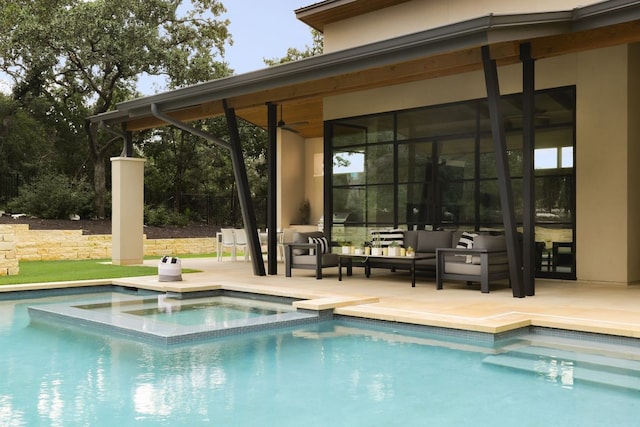 view of pool featuring ceiling fan, an in ground hot tub, outdoor lounge area, and a patio