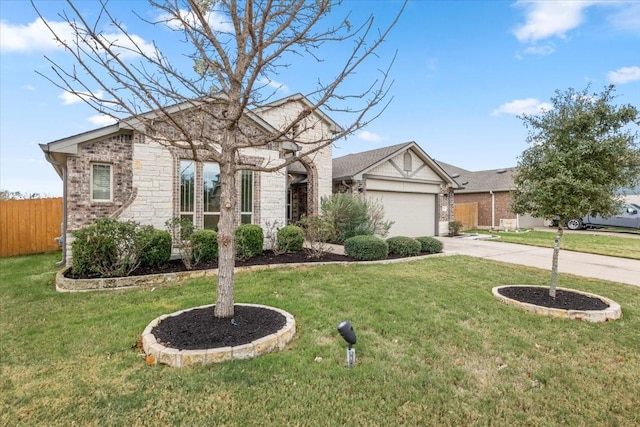 view of front of house with a front yard and a garage