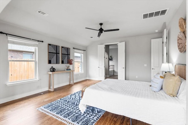 bedroom featuring vaulted ceiling, light wood-type flooring, and ceiling fan