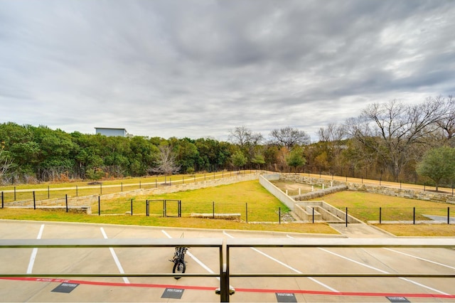 surrounding community featuring a rural view and a lawn