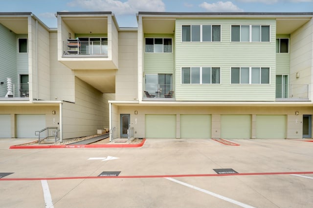 rear view of house featuring a garage