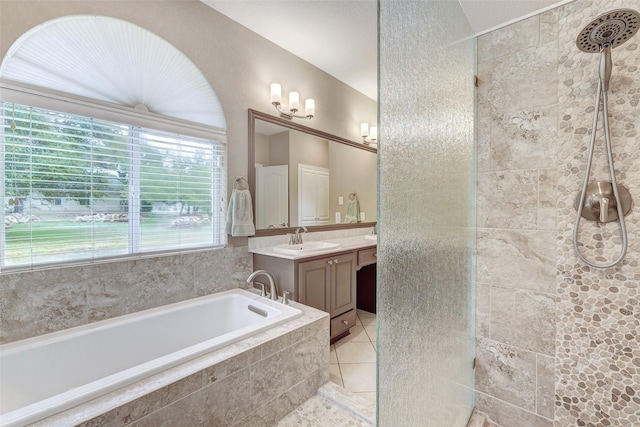 bathroom featuring tile patterned flooring, separate shower and tub, and vanity