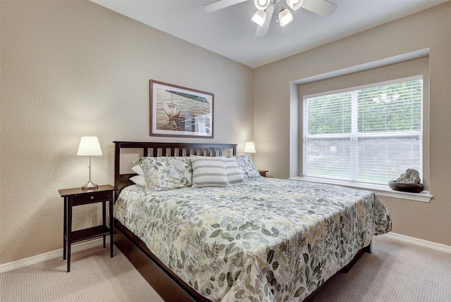 bedroom with ceiling fan and carpet