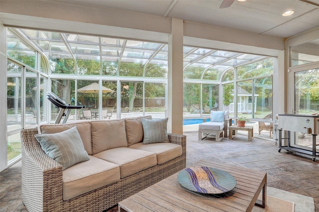 sunroom with ceiling fan and plenty of natural light