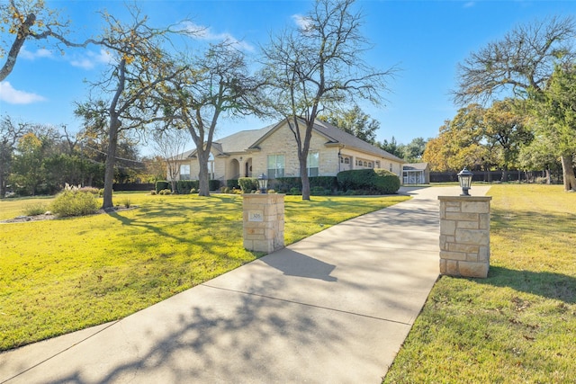 ranch-style house featuring a front lawn