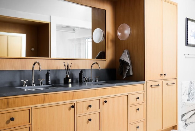 bathroom featuring decorative backsplash and vanity