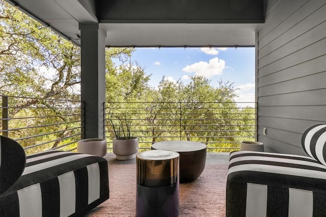 view of patio featuring a balcony