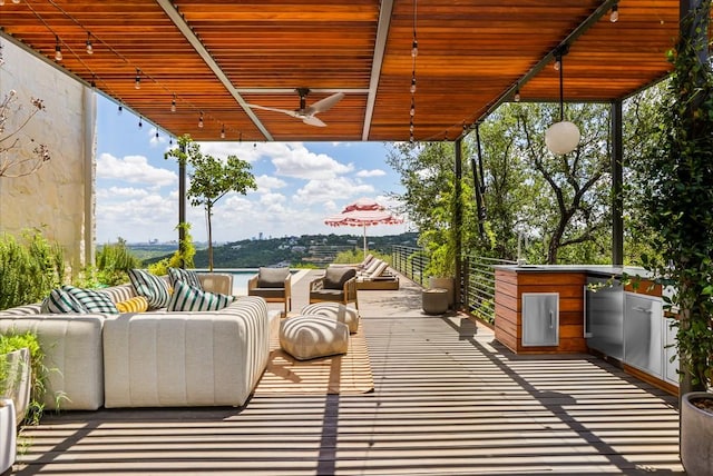 view of patio / terrace with an outdoor hangout area and ceiling fan