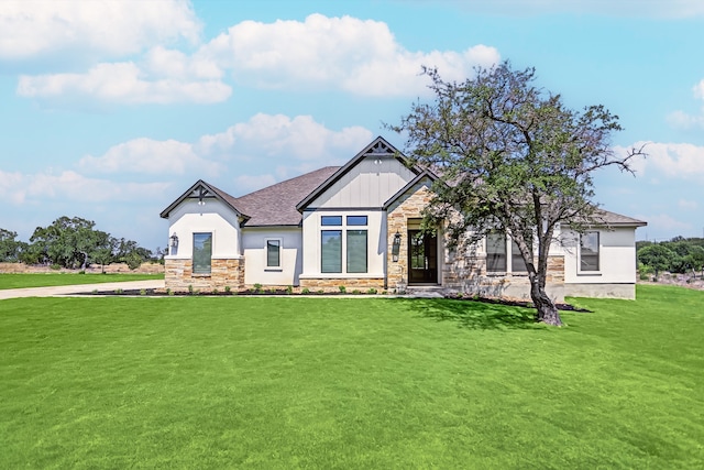 craftsman inspired home with a front lawn