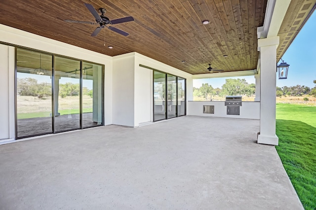 view of patio / terrace featuring ceiling fan, exterior kitchen, and grilling area