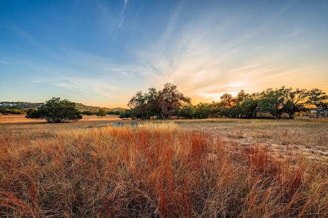 nature at dusk featuring a rural view