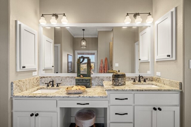 bathroom with vanity and ornamental molding