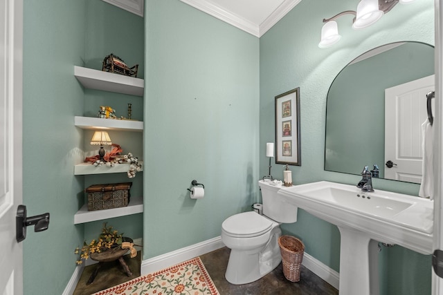 bathroom featuring ornamental molding, built in features, sink, and toilet