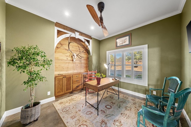 office space featuring concrete floors, ceiling fan, and crown molding