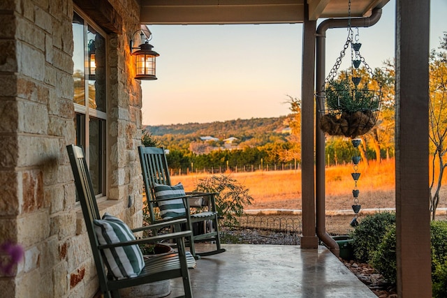 view of patio terrace at dusk