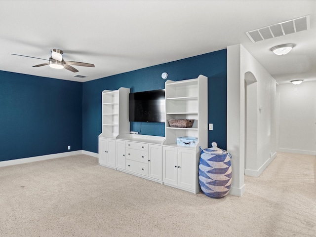 living room featuring ceiling fan and light carpet