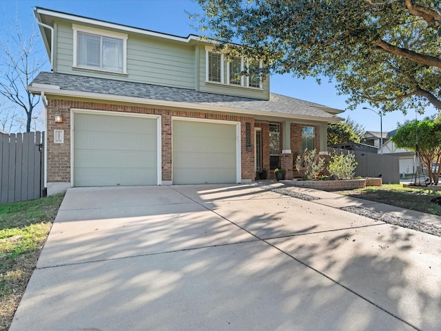 view of front of home featuring covered porch and a garage