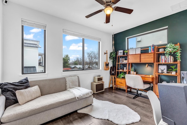 office space featuring hardwood / wood-style floors, a healthy amount of sunlight, and ceiling fan