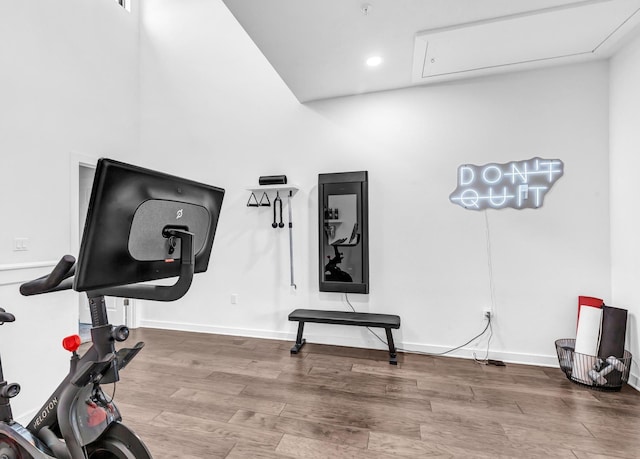 exercise room with hardwood / wood-style floors