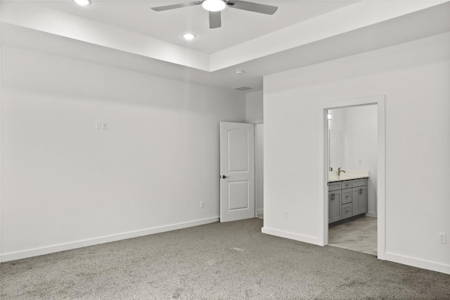 20714 Northland Dr, Lago Vista, TX 78645 - unfurnished bedroom featuring light carpet, recessed lighting, ensuite bath, and ceiling fan