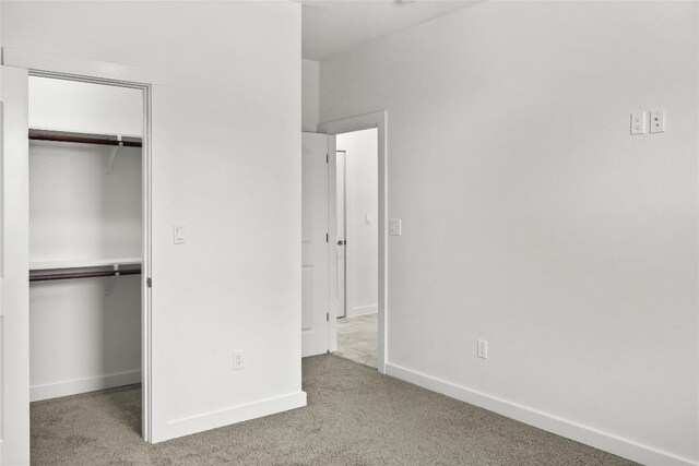 20714 Northland Dr, Lago Vista, TX 78645 - unfurnished bedroom featuring carpet floors and a walk in closet