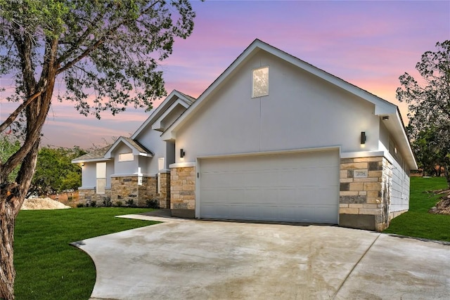 20714 Northland Dr, Lago Vista, TX 78645 - view of front of home with stone siding, stucco siding, driveway, and a front yard