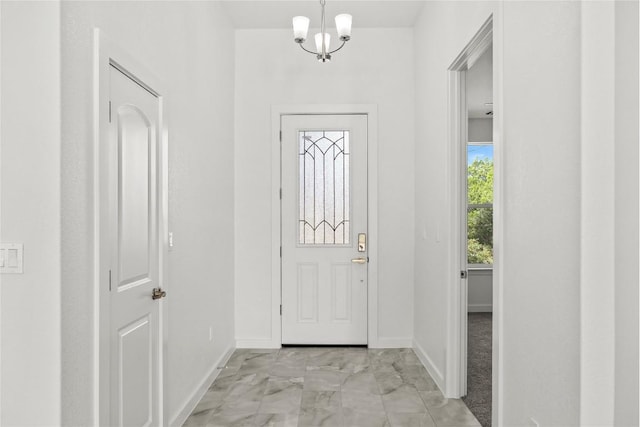 20714 Northland Dr, Lago Vista, TX 78645 - foyer featuring light marble finish flooring and a chandelier