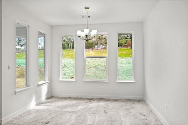 20714 Northland Dr, Lago Vista, TX 78645 - unfurnished dining area with a chandelier and light marble finish floors